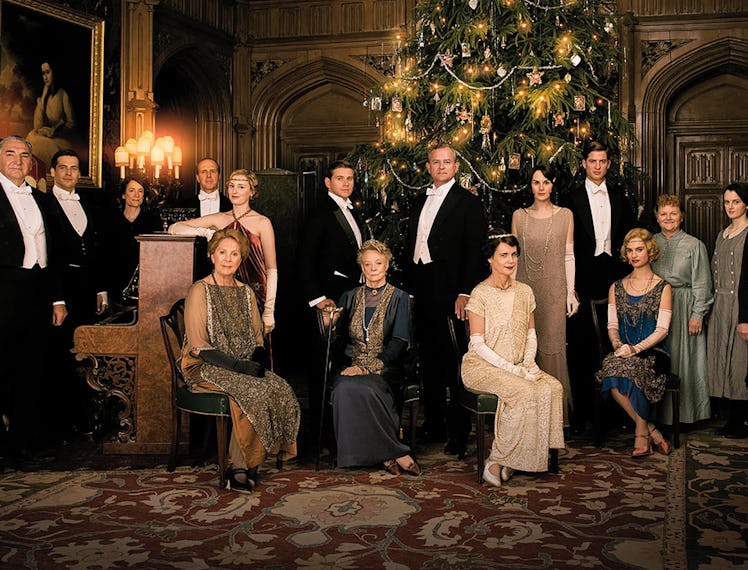 The cast of Downtown Abbey posing in front of a Christmas Tree for the sequel