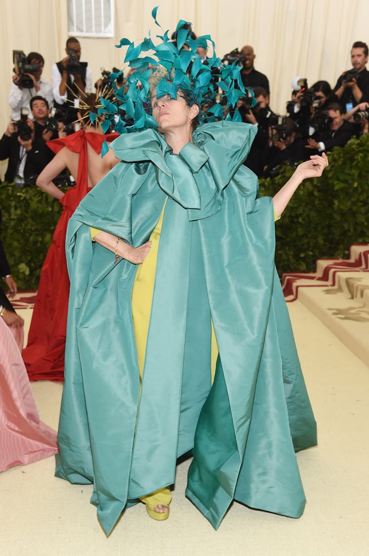 Frances McDormand wearing a blue feather headdress at the Met Gala