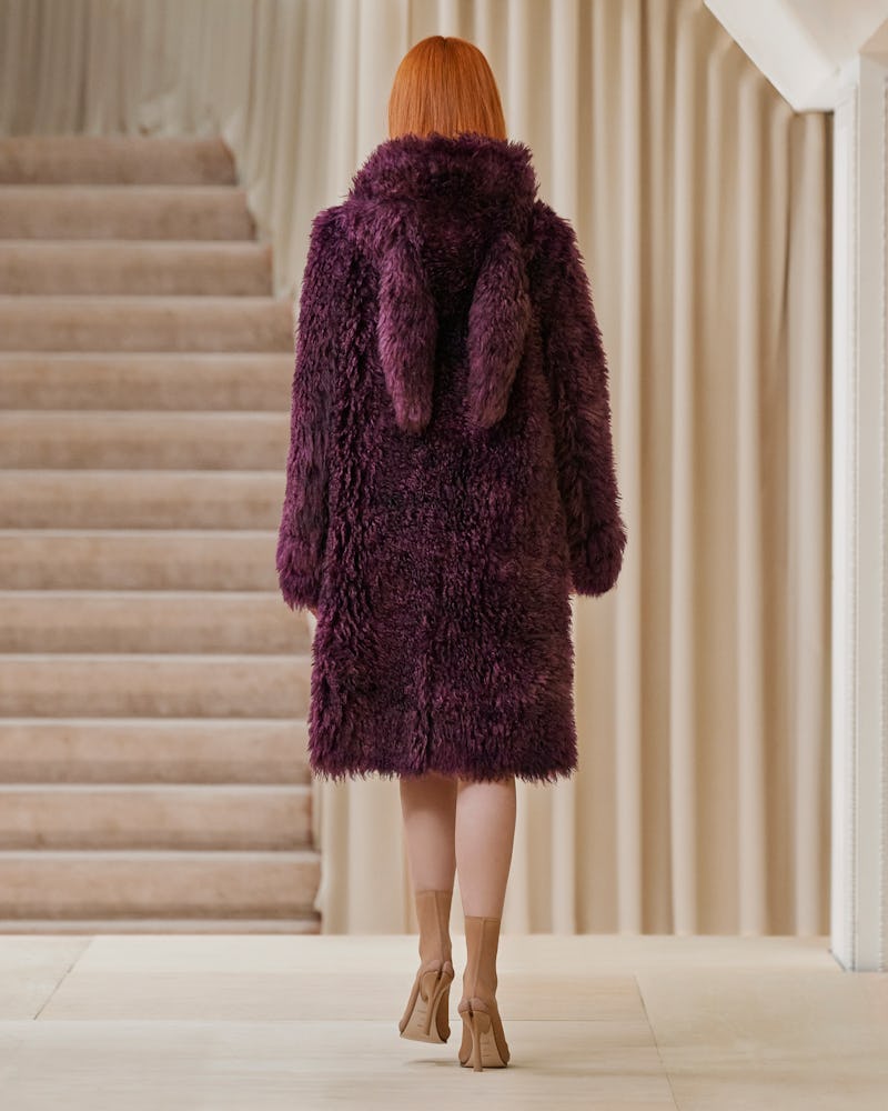 Model walks in Burberry's Fall/Winter 2021 show wearing a furry coat.