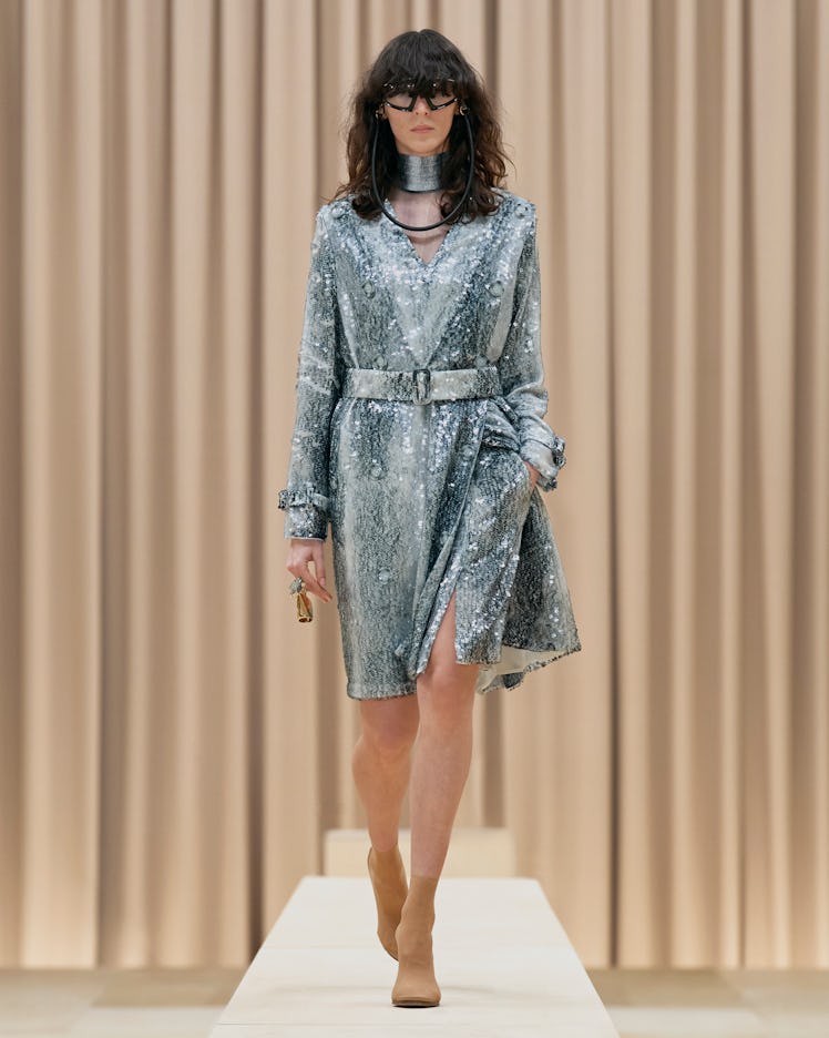 A model in a Burberry silver sequin dress and silver choker at the London Fashion Week