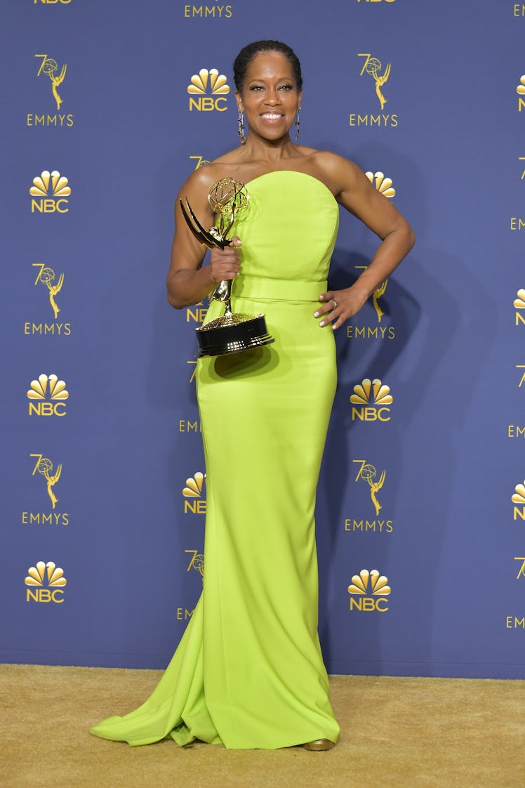 Regina King holding her Emmy