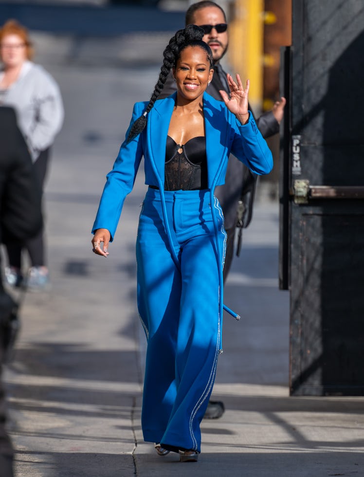 Regina King waving to passersby