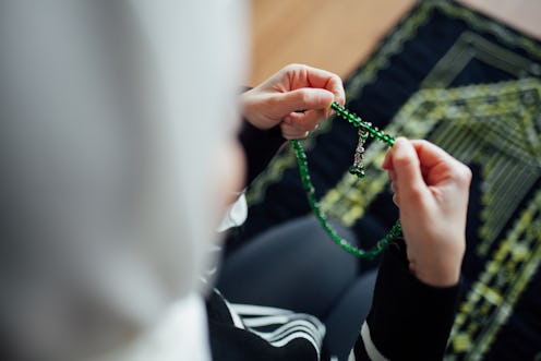 A woman praying during Ramadan.