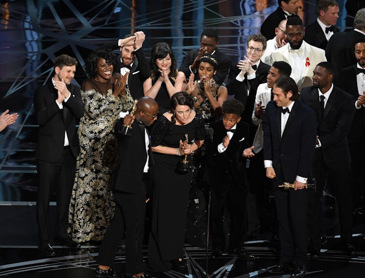 The cast and crew of 'Moonlight' accept the Best Picture award.