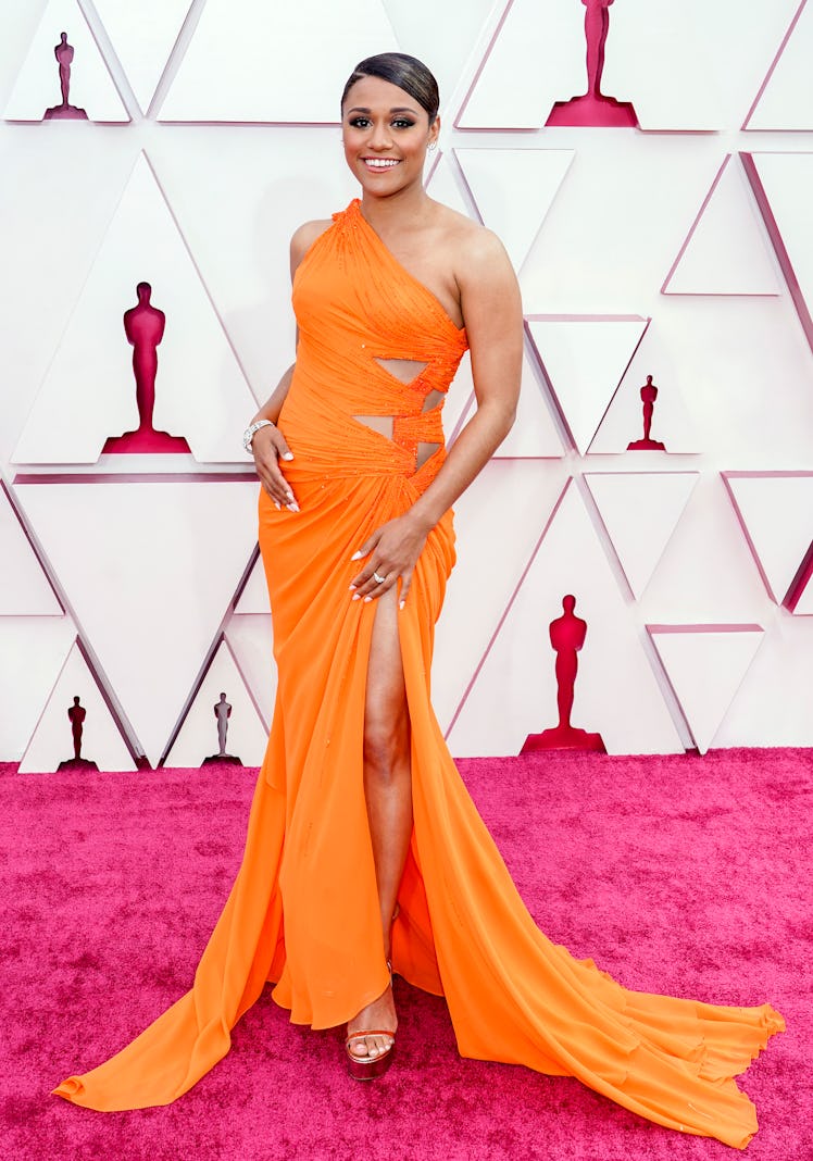 Ariana DeBose  in orange Versace gown