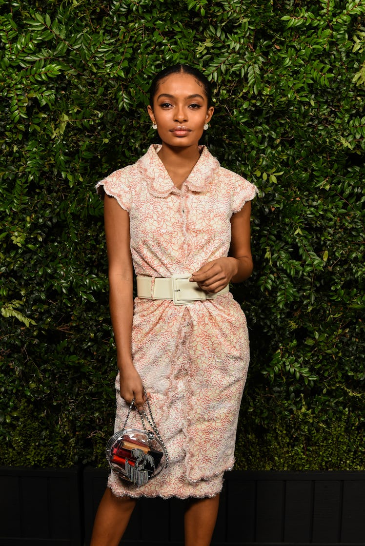 Yara Shahidi in a white floral dress at Chanel’s Pre-Oscars Dinner