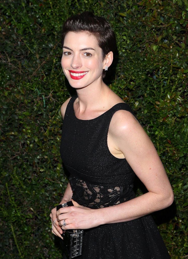 Anne Hathaway in a black dress at Chanel’s Pre-Oscars Dinner