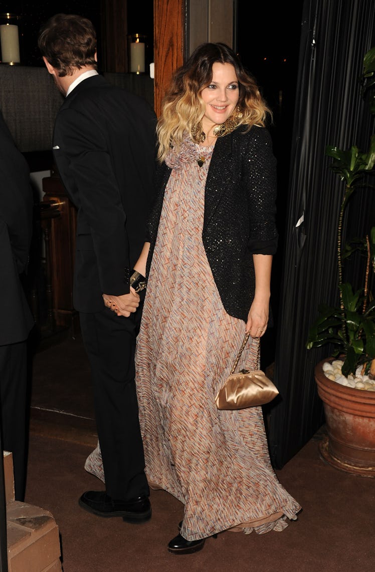 Drew Barrymore in a beige patterned dress and a black jacket at Chanel’s Pre-Oscars Dinner