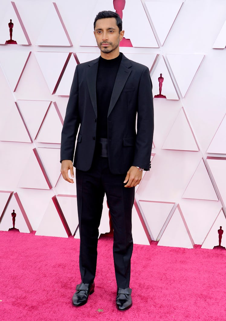 Riz Ahmed in a black Prada suit at the Oscars 2021