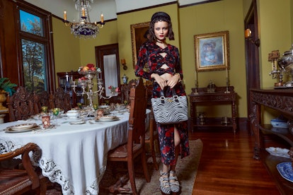 Designer Autumn Adeigbo's dark & floral combination with a zebra print handbag 