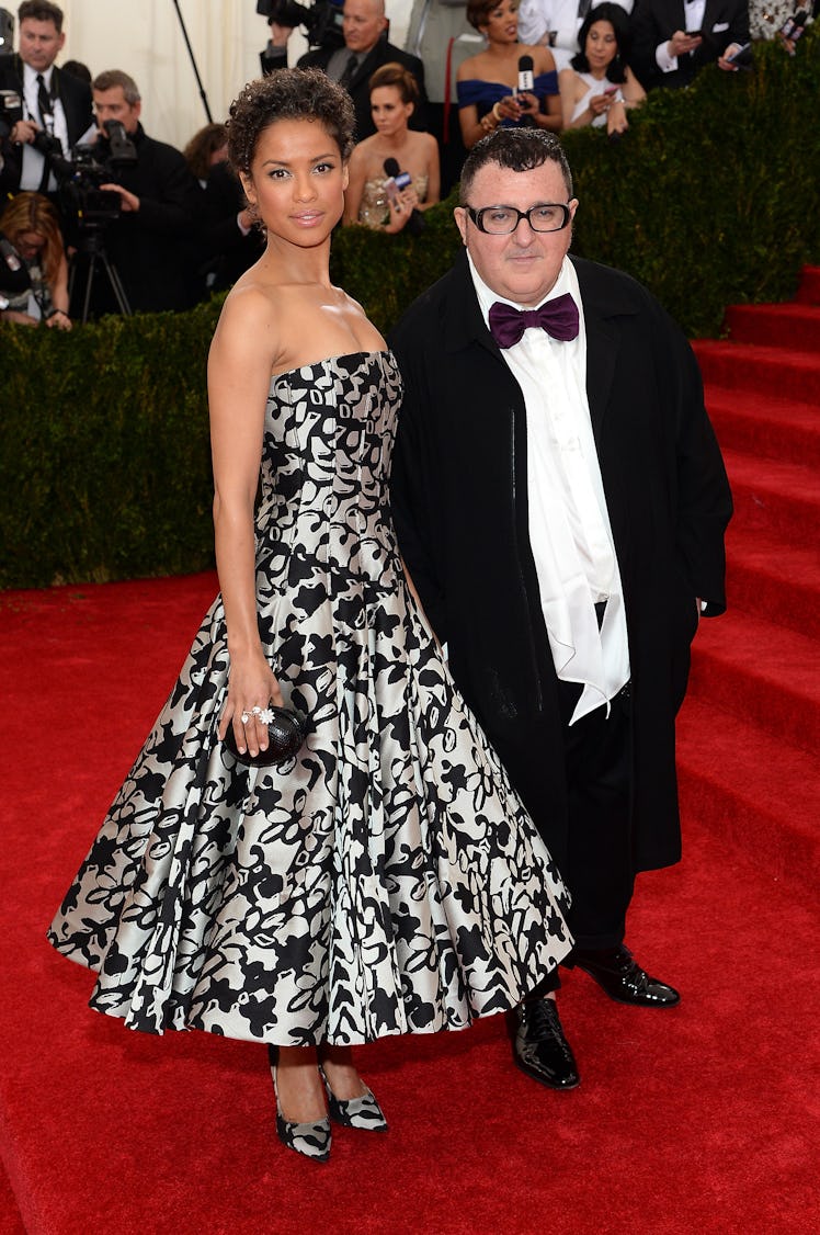 Gugu Mbatha-Raw at the Met Gala in a silver-black dress next to Alber Elbaz in 2014