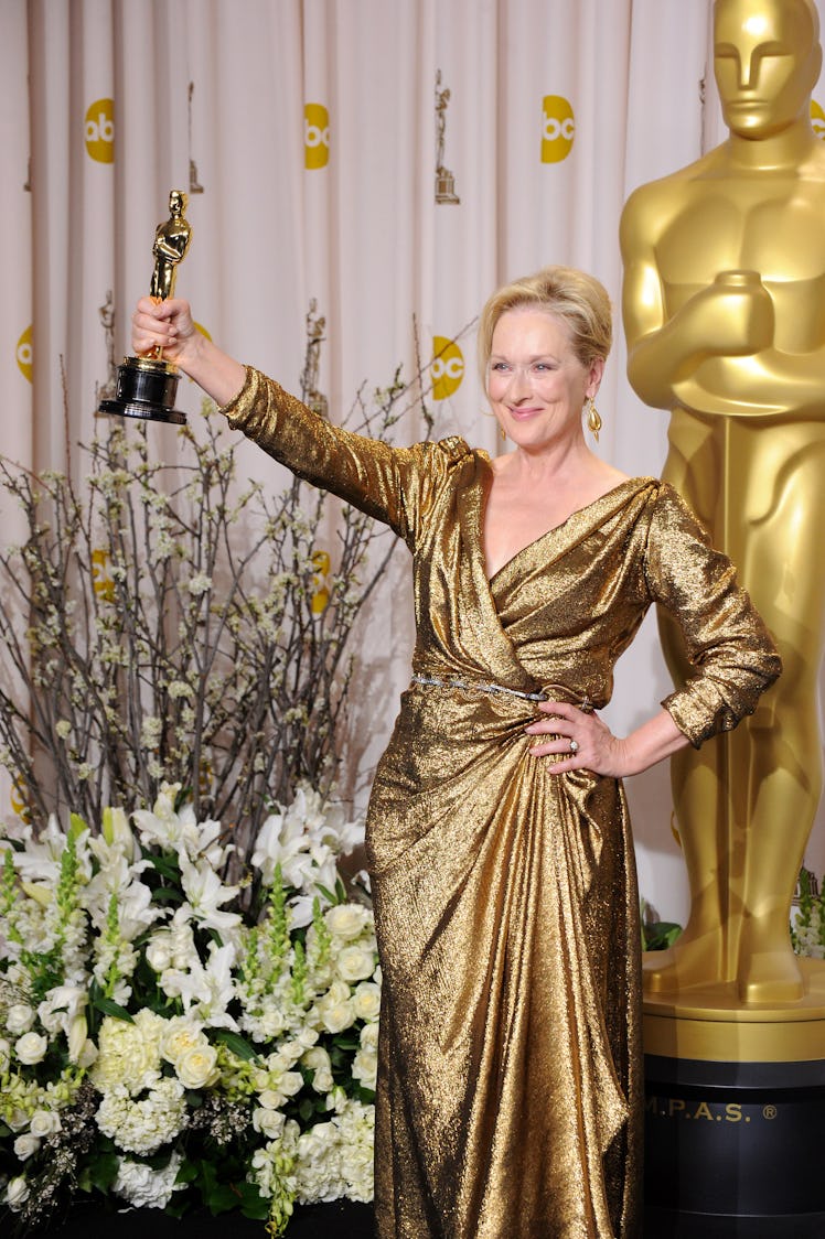 Meryl Streep with Oscar in gold gown by Alber Elbaz at the Oscars 2012