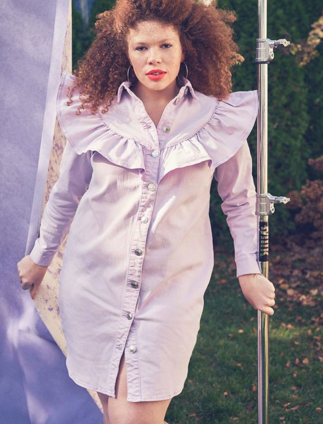 Model wearing purple denim dress from ELOQUII.