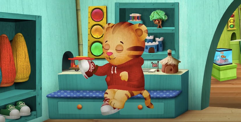 Daniel Tiger, a character 2 year olds will love, puts on his shoes