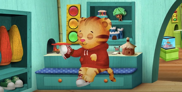 Daniel Tiger, a character 2 year olds will love, puts on his shoes