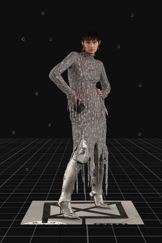 Model wearing Balenciaga's Silver Embroidered Flame Dress during the brand's Fall Winter 2021 runway...