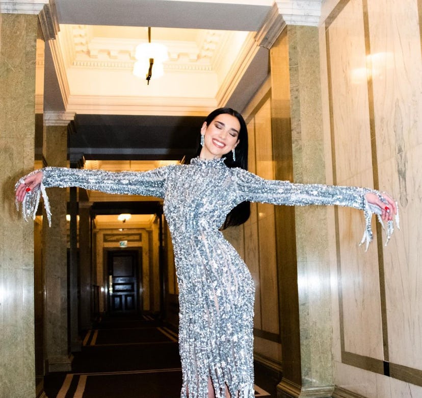 Dua Lipa in a silver fringe gown from Balenciaga.