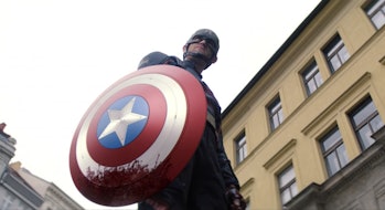 Wyatt Russell as John Walker holding the bloody Captain America shield in The Falcon and the Winter ...
