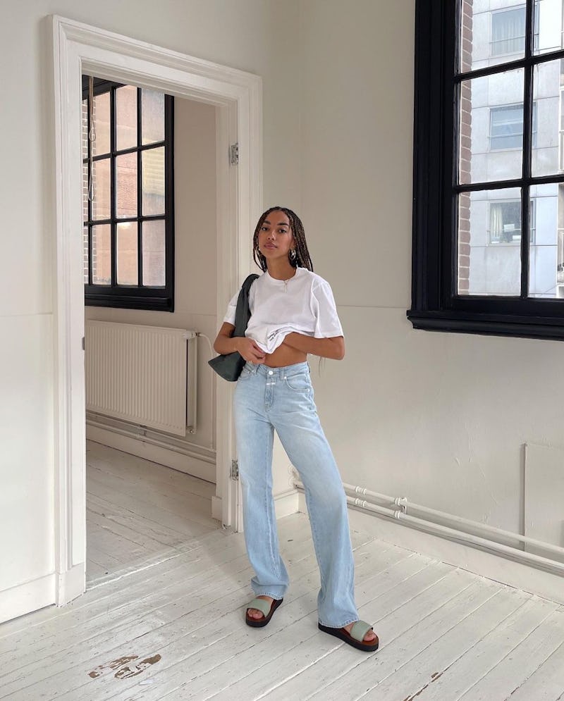 Influencer and Instagram content creator Amaka Hamelijnck wearing baggy jeans from Closed Official with slides.