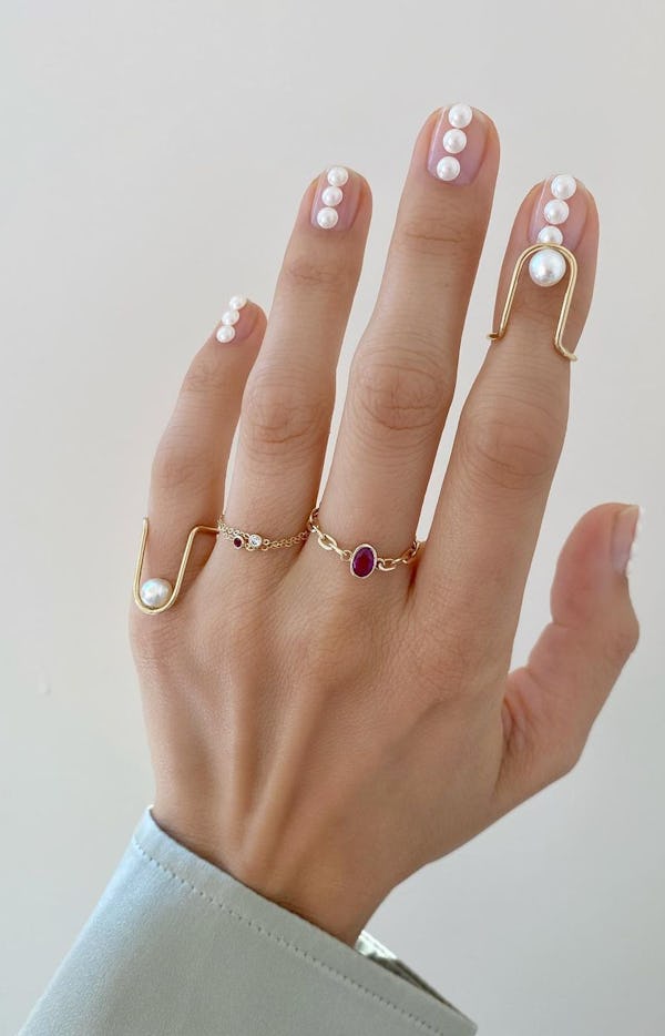 Pearls on nails and ruby ring