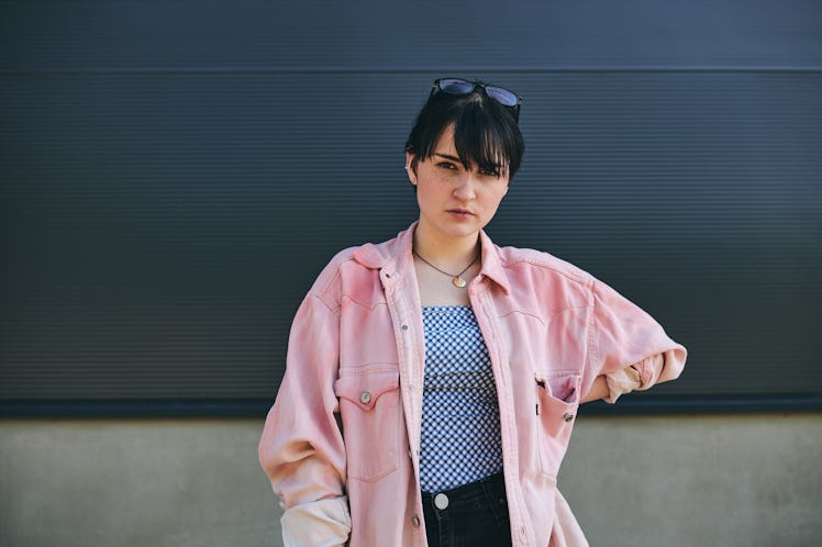 Judgmental woman looking for her zodiac sign