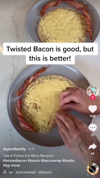 A woman wraps some twisted bacon in a tortilla with cheese for bacon wraps. 