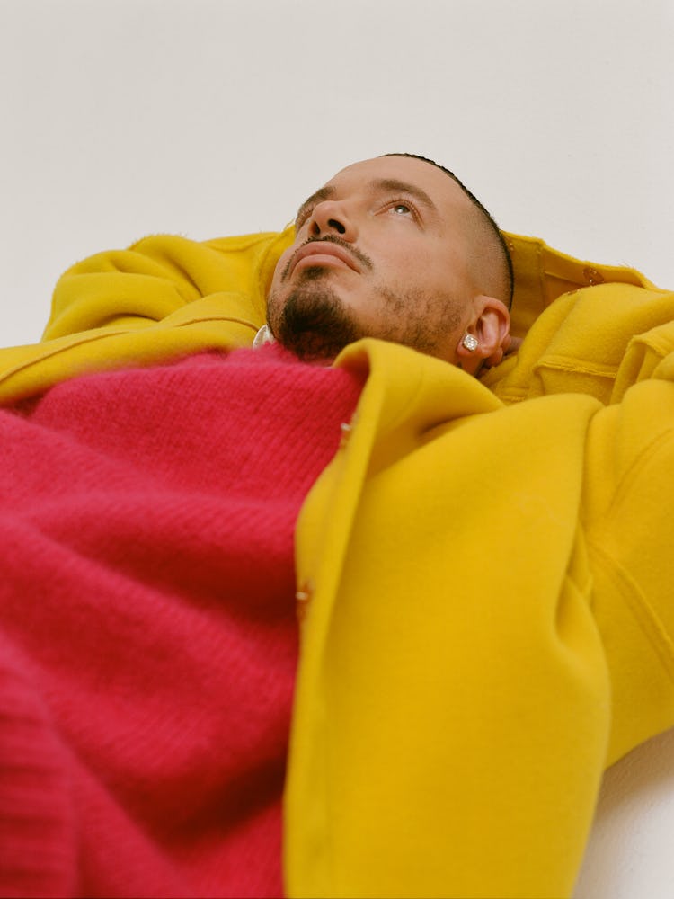 J Balvin in a Raf Simons jacket and sweater.