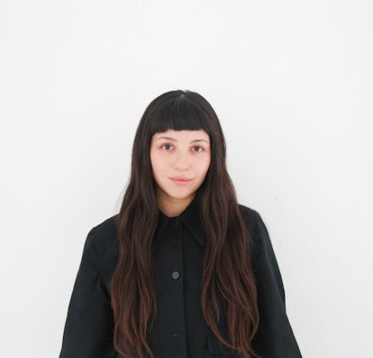 Kara Jubin in a black shirt in front of a white background