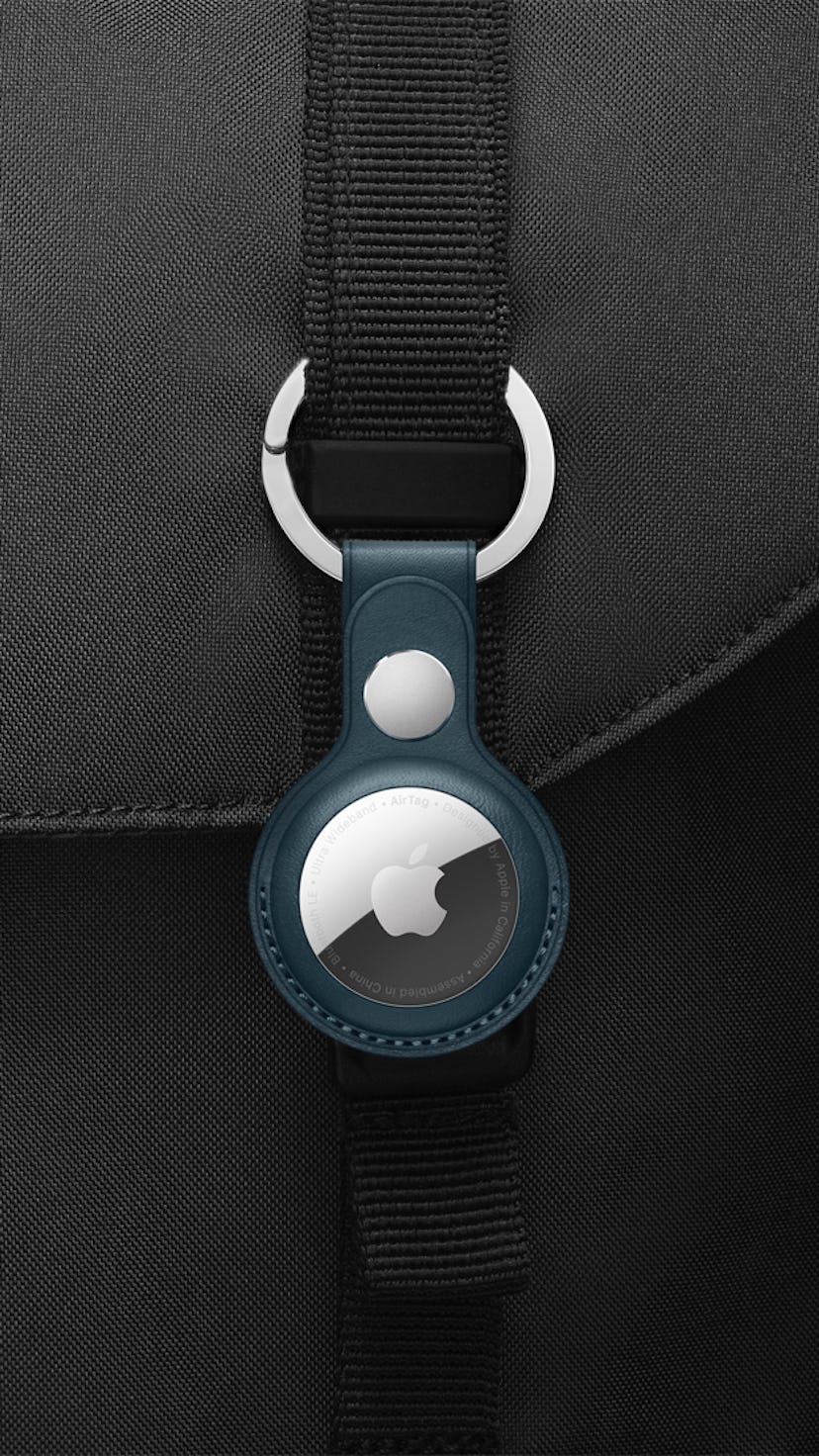Apple AirTags clipped onto bag.