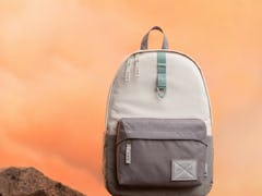 A Baby Yoda-inspired backpack from the Herschel x 'Star Wars' 'The Mandalorian' collection sits on s...