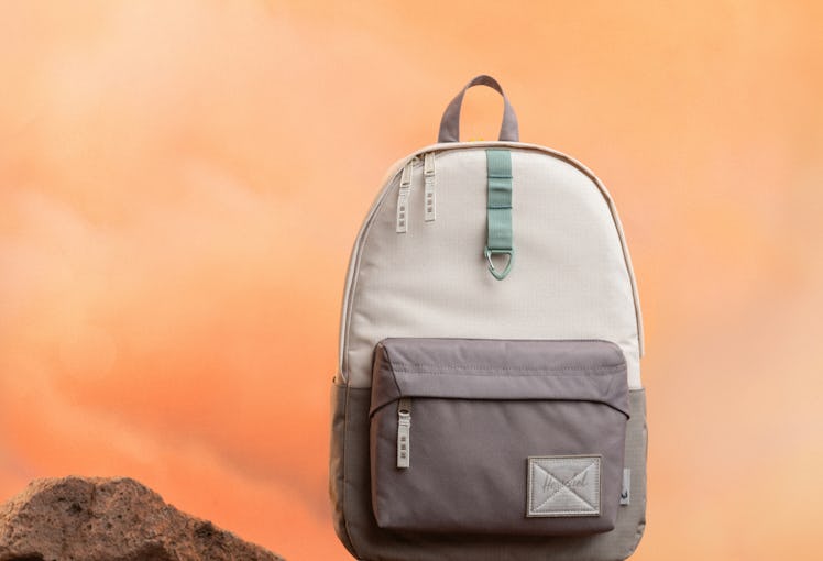 A Baby Yoda-inspired backpack from the Herschel x 'Star Wars' 'The Mandalorian' collection sits on s...