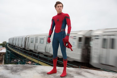 Tom Holland as Peter Parker/Spider-Man standing by train in Spider-Man: Homecoming