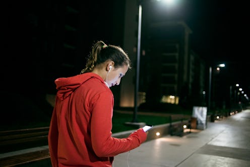 Woman going on a run at nighttime