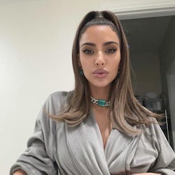 a selfie of kim kardashian wearing a gray robe