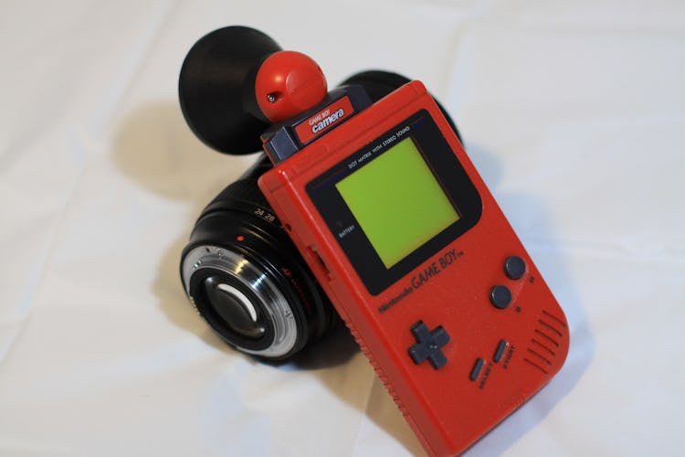 A 3D-printed Canon lens adapter for the Game Boy Camera by Andreas Gack aka Herr Zatacke.