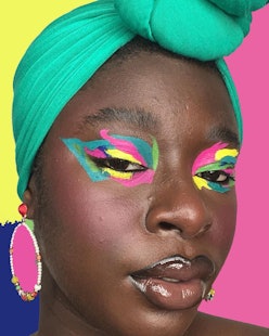 Woman with a dark skin tone wearing colorful eyeshadow and a mint green headscarf