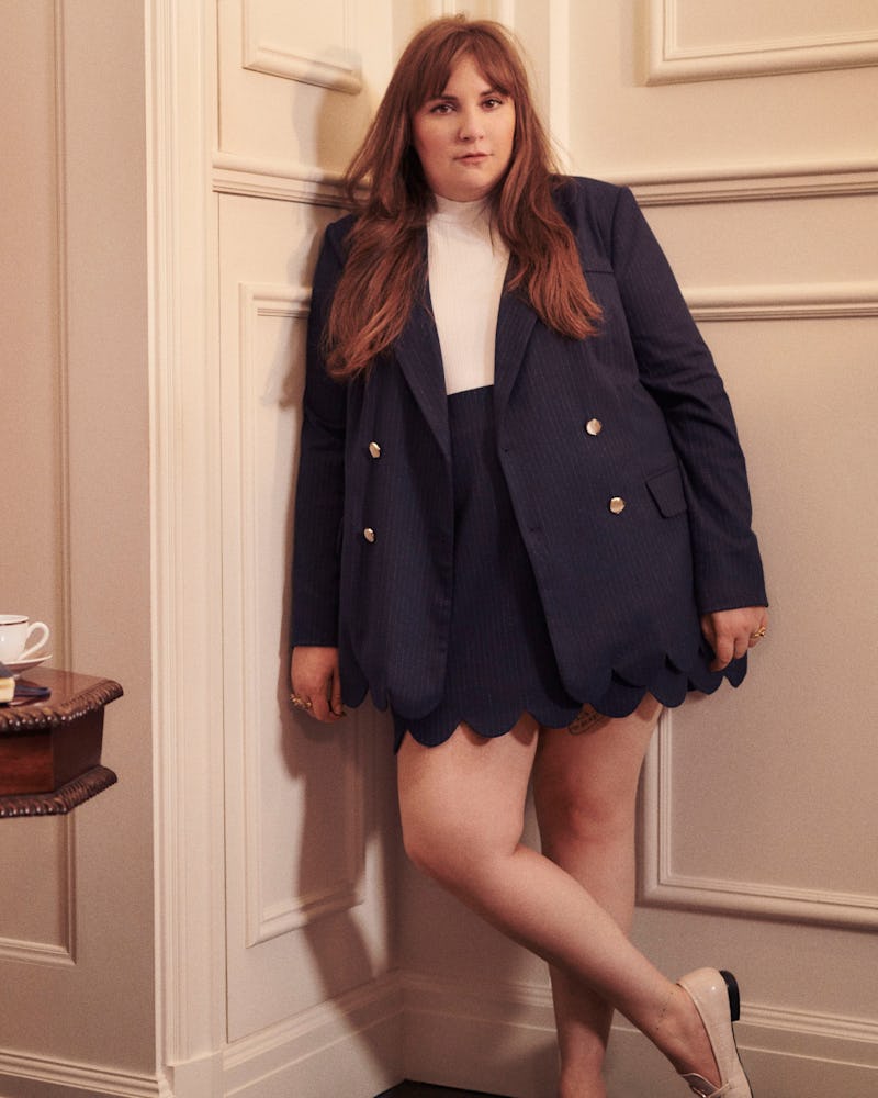 Lena Dunham wears a matching jacket and skirt set from her clothing line collaboration with plus-siz...