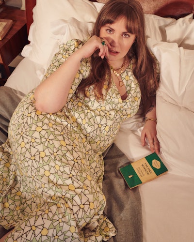 Lena Dunham wears a dress from her clothing line collaboration with plus-size designer brand and onl...