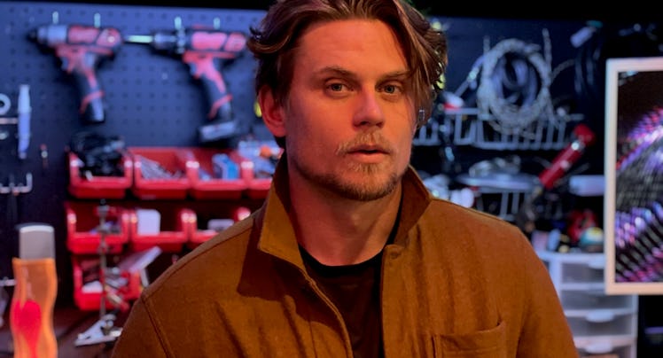 Billy Magnussen in a wood shop.