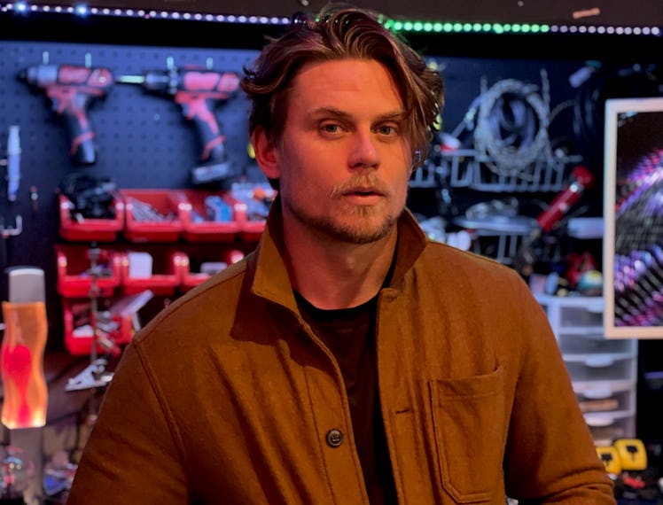 Billy Magnussen in a wood shop.