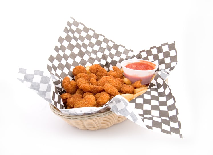 Basket of fried food with ketchup