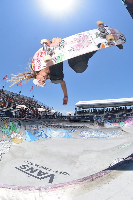 Teen skateboard champion Brighton Zeuner, seen in mid-air and upside down, as she performs a flip at...