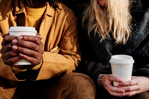 Two people drinking coffee