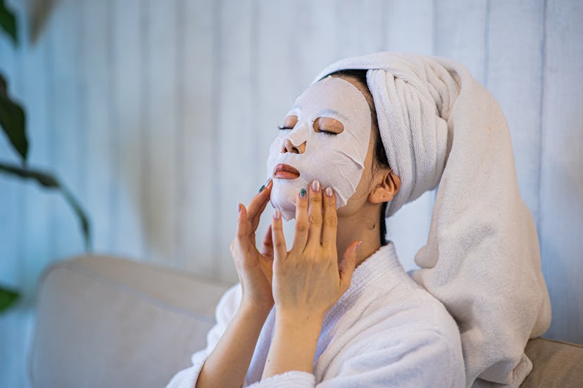 Woman wearing sheet mask