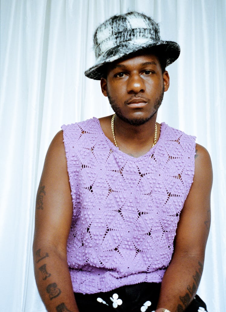 Leon Bridges wears a Bode top and shorts; his own hat and jewelry (throughout).