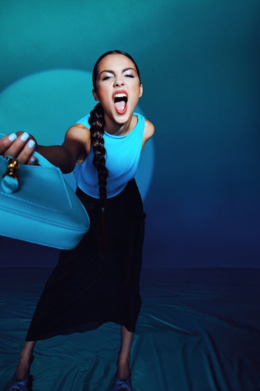 "Drivers License" singer Olivia Rodrigo wears a blue top and long black skirt for NYLON's cover.