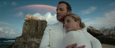 Leo and Liz wearing white clothes while hugging in the last shot of Oxygen