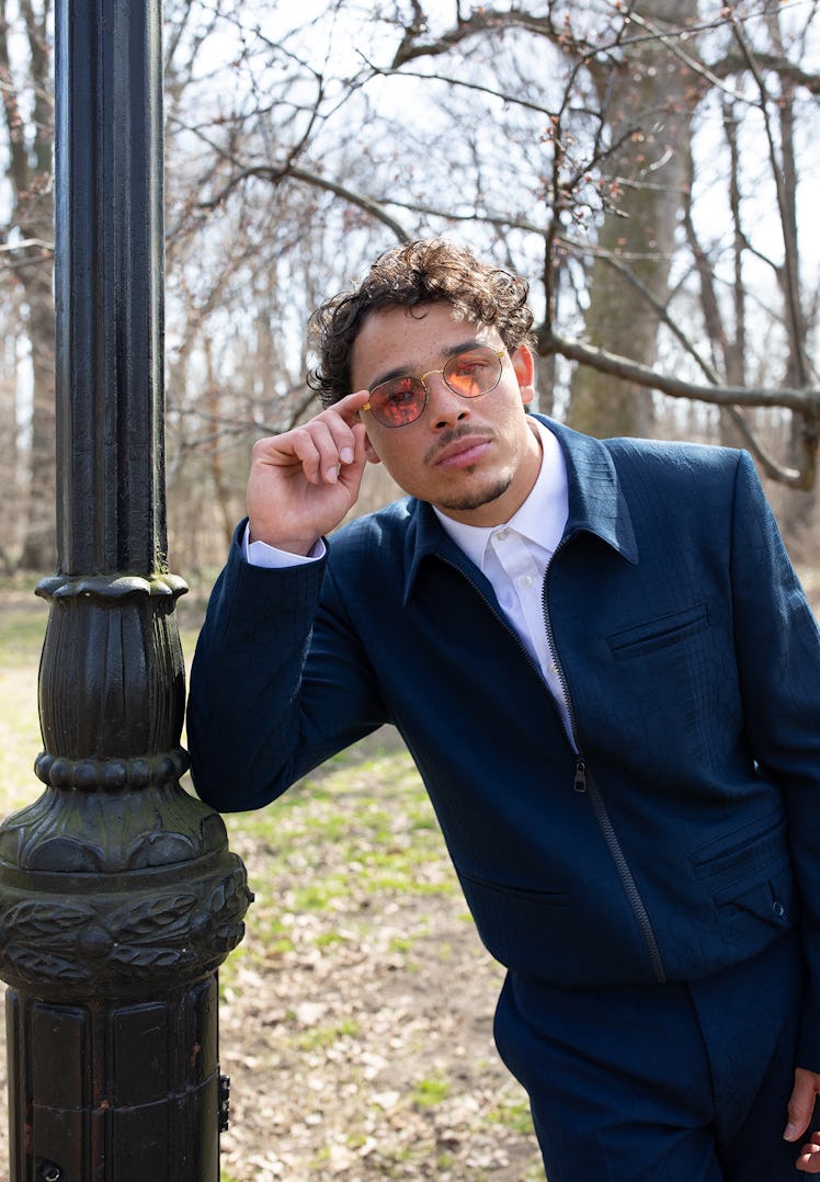 Anthony Ramos wears a Louis Vuitton Men’s jacket, shirt, and pants; stylist’s own sunglasses. Groomi...
