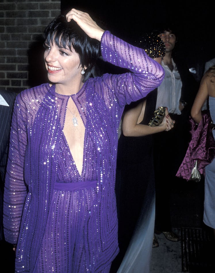 Liza wearing purple jumpsuit