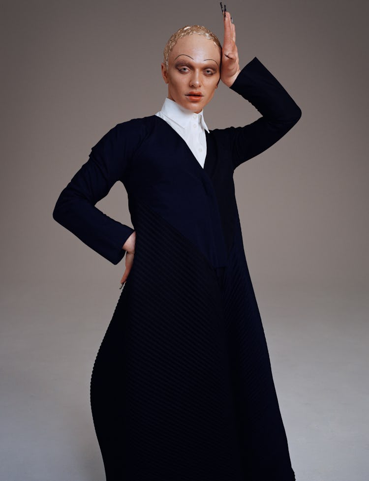 Model Bimini Bon Boulash wears a Loewe jacket and skirt; Prada white romper.